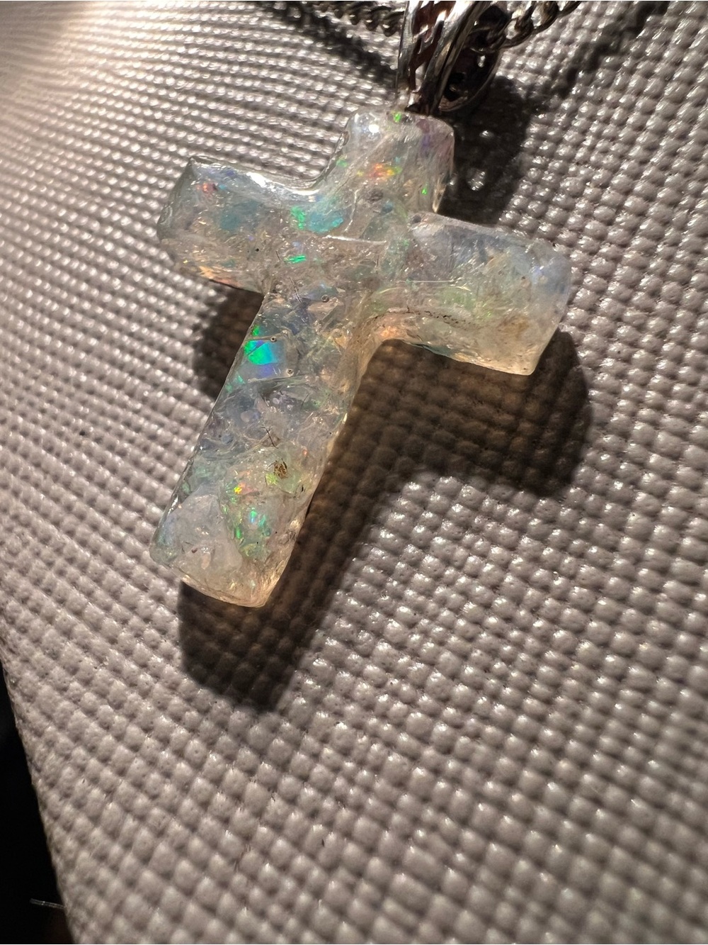 Iridescent White Crushed Opal Cross Pendant Necklace read below